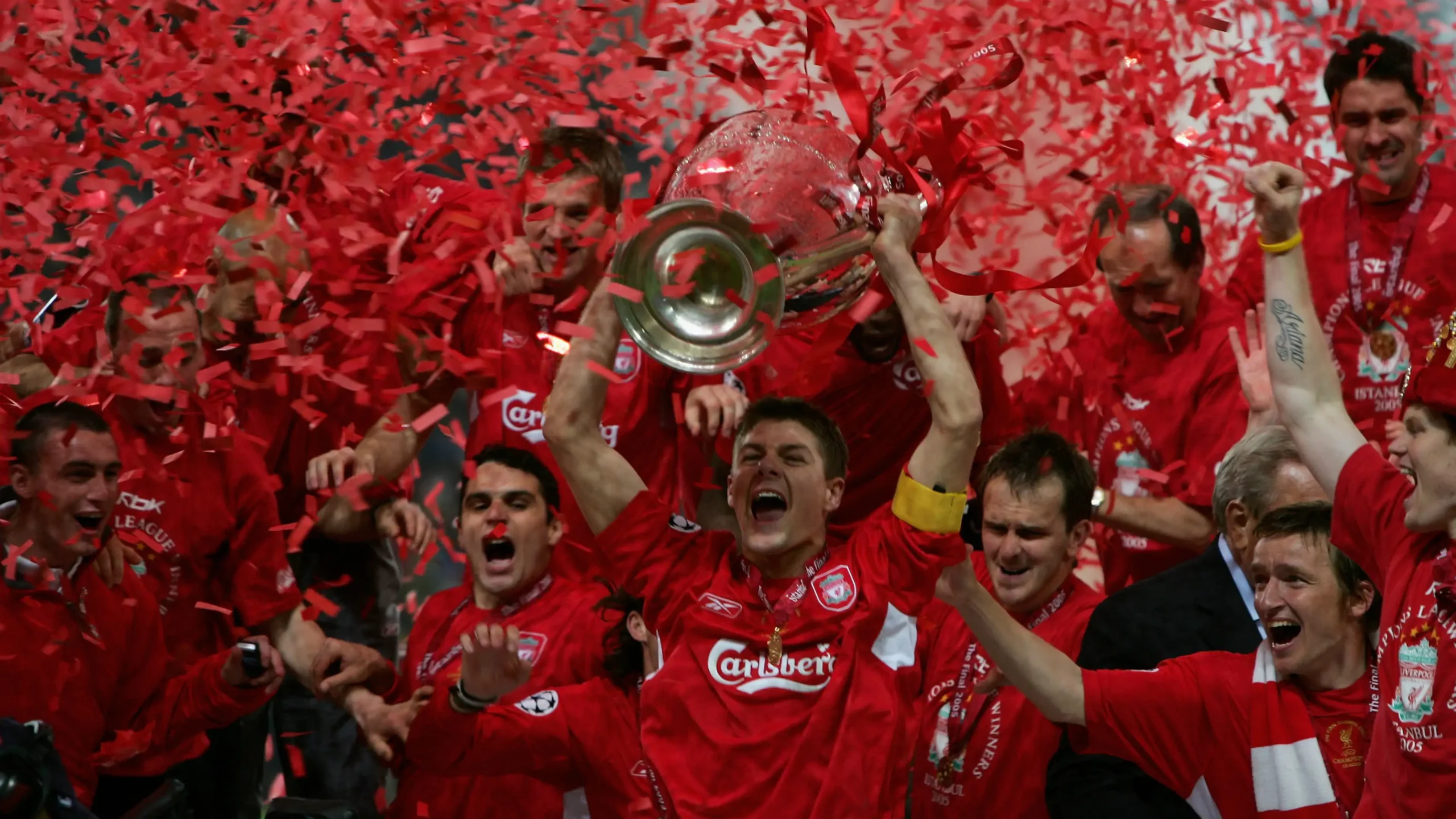 Gerrard picks up the Champions League trophy after the Miracle of Istanbul